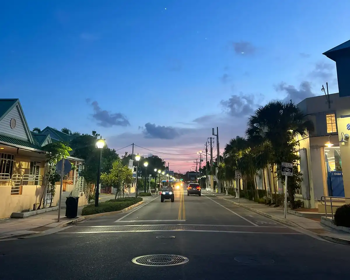 Key West street at dusk with pink sky