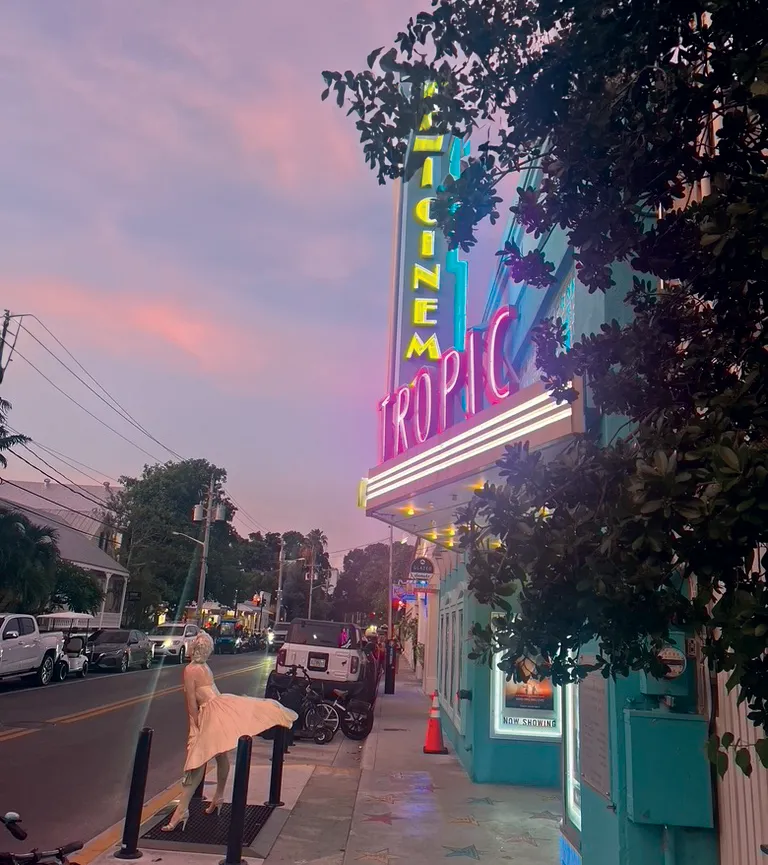 Tropic Cinema neon sign at dusk in Key West